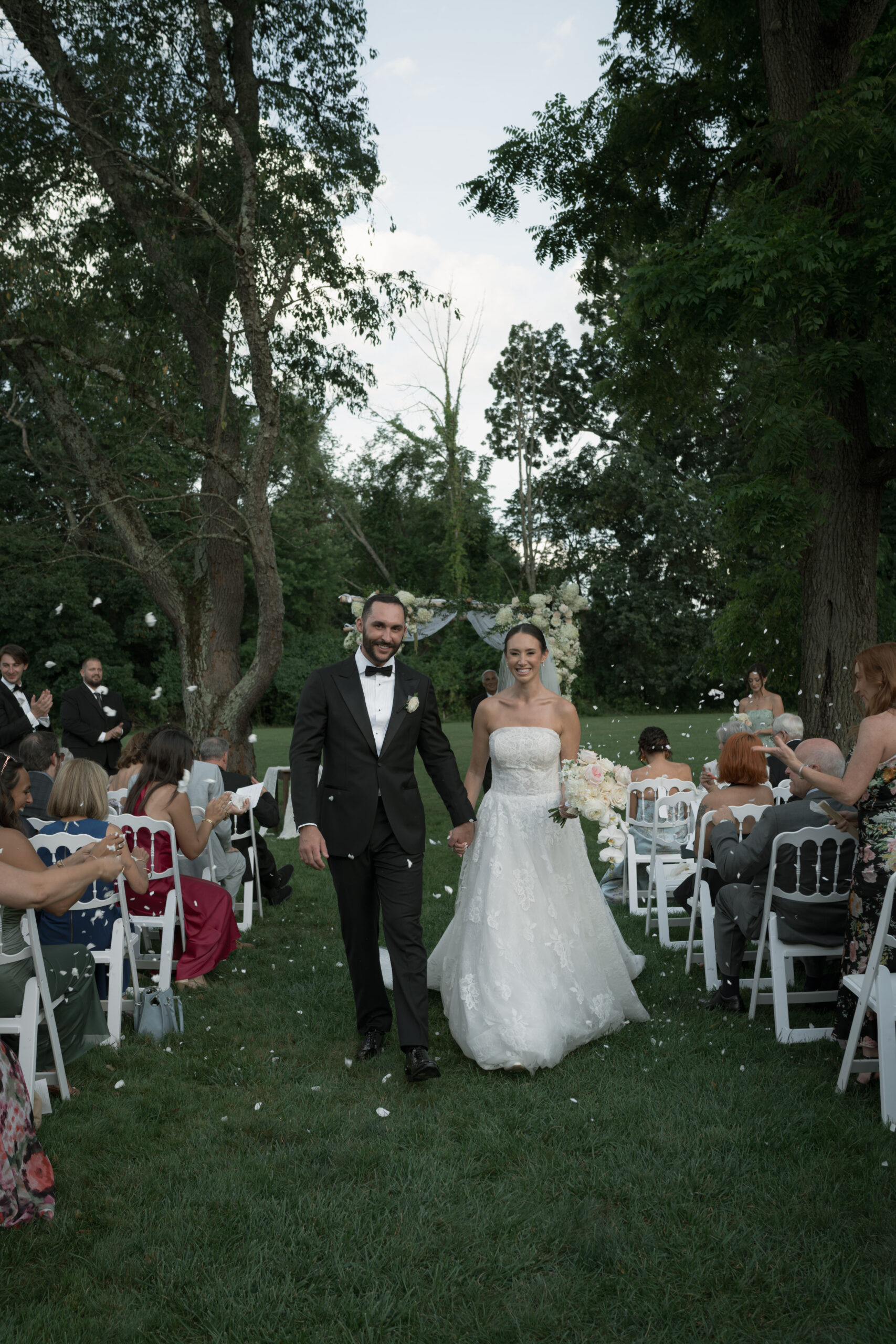 Bride and Groom recess down the aisle as petals are tossed at the Inn at Barley Sheaf Farm